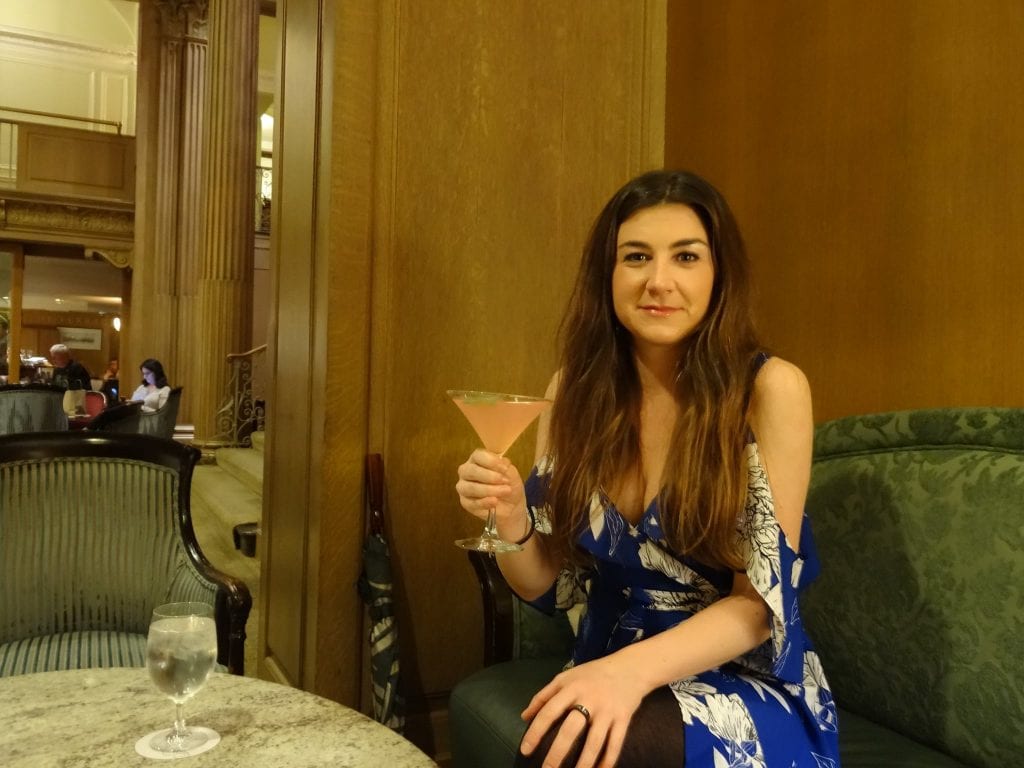 lady enjoying a cocktail in seattle 