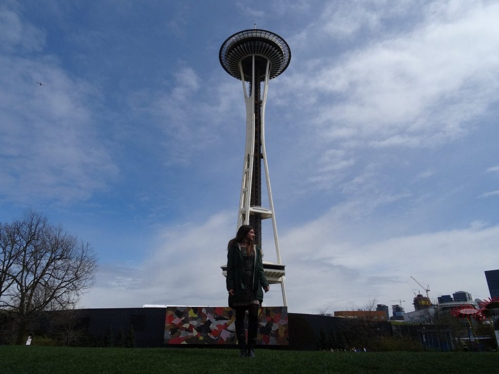 ladie posing at the space needle seattle