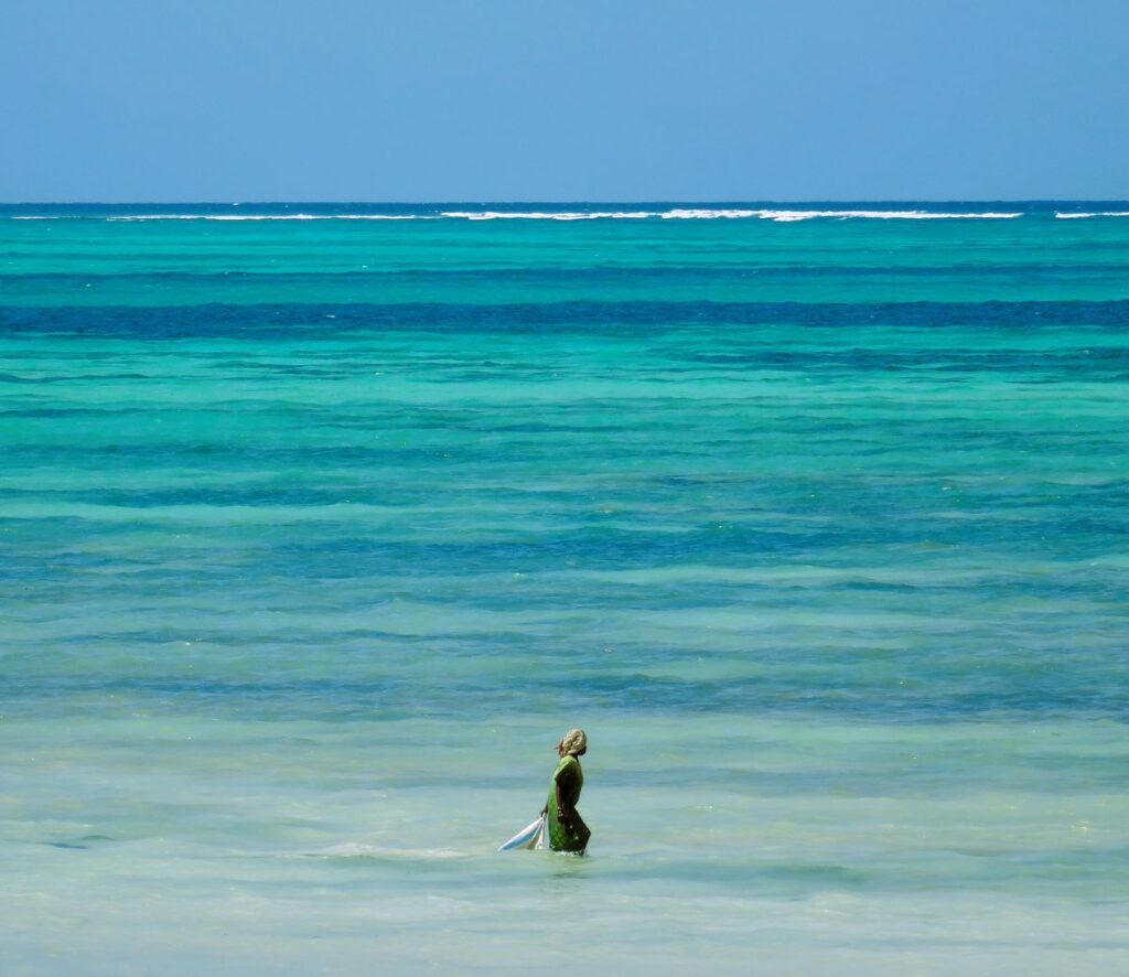 local woman in water jambiani