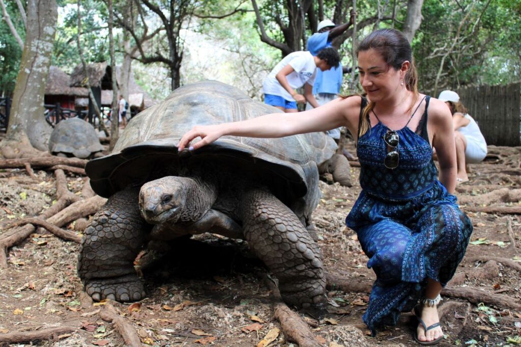 lady with giant tortoise prison island