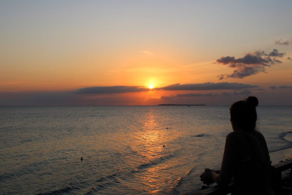 lady watching sunset stone town