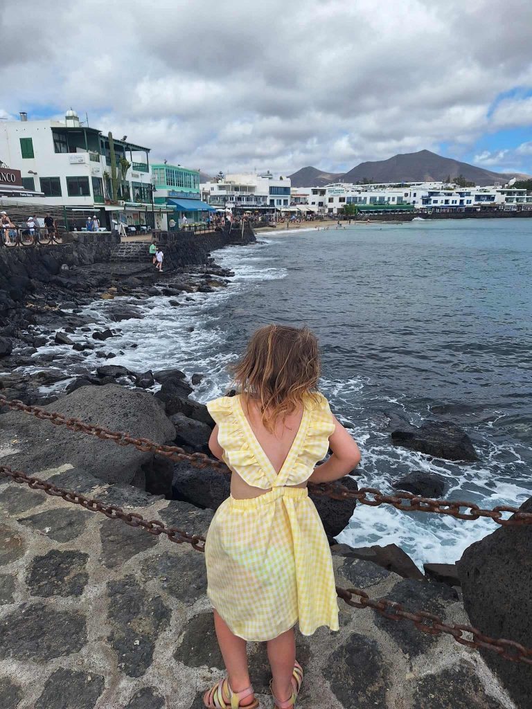 girl on playa blanca coastal walk