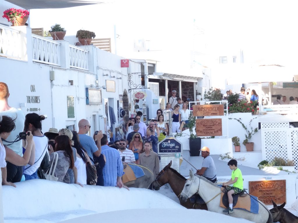 crowds watching the sunset in Oia