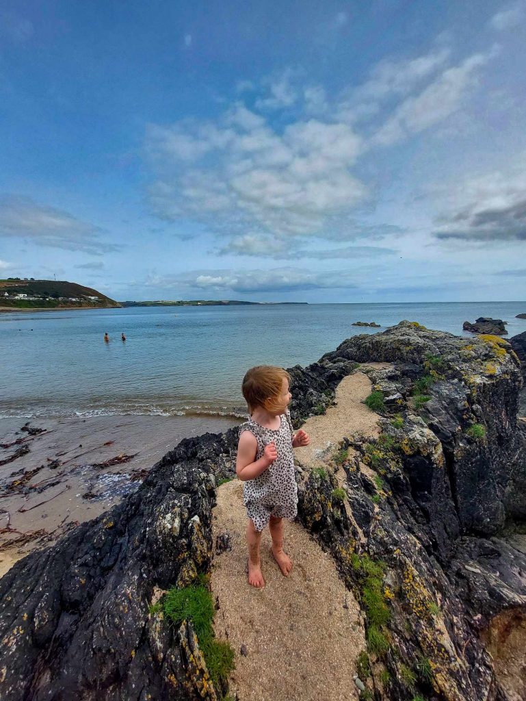 girl on a rock at myrtleville beach