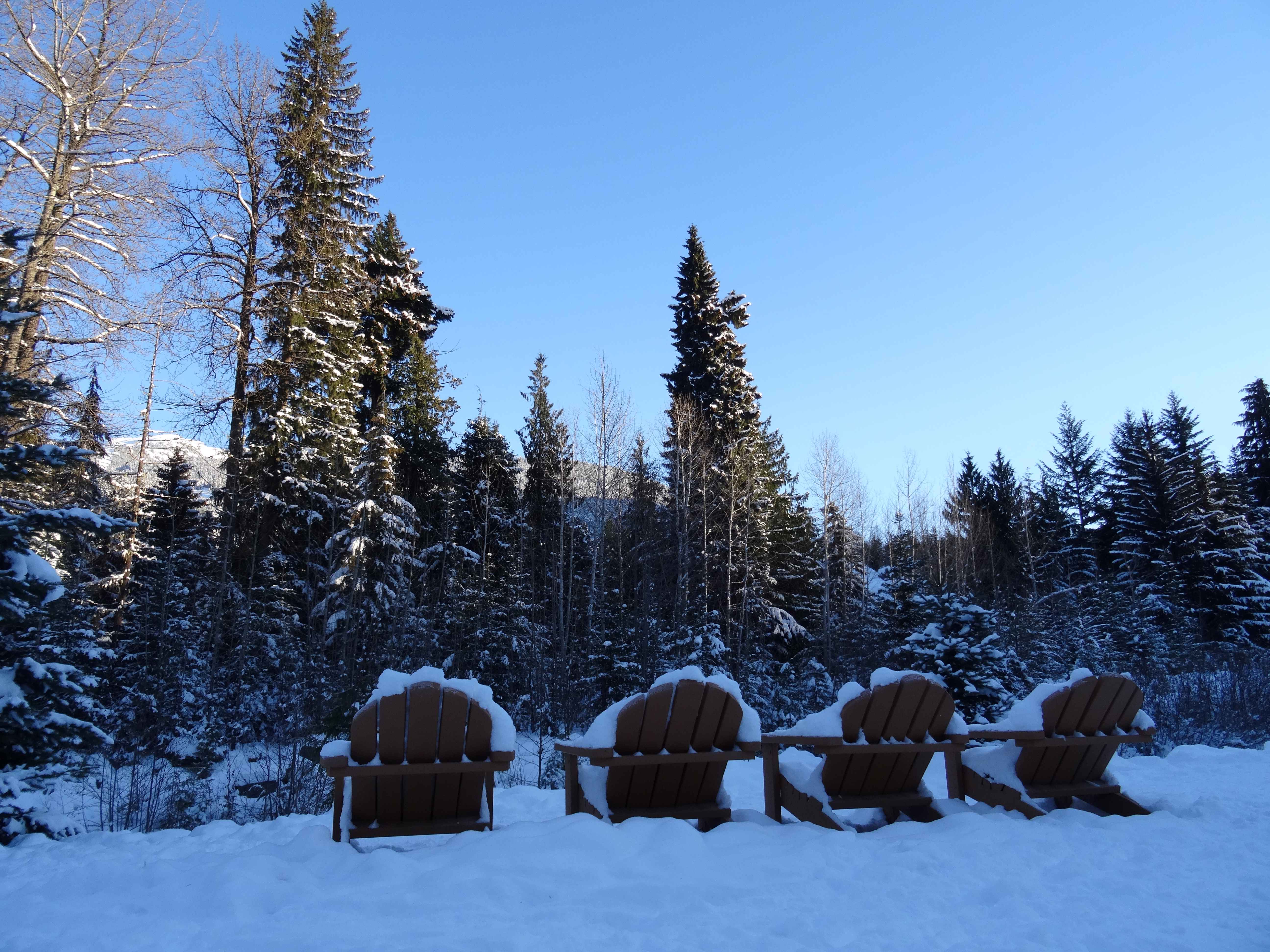 adirondack chairs in snow in whistler