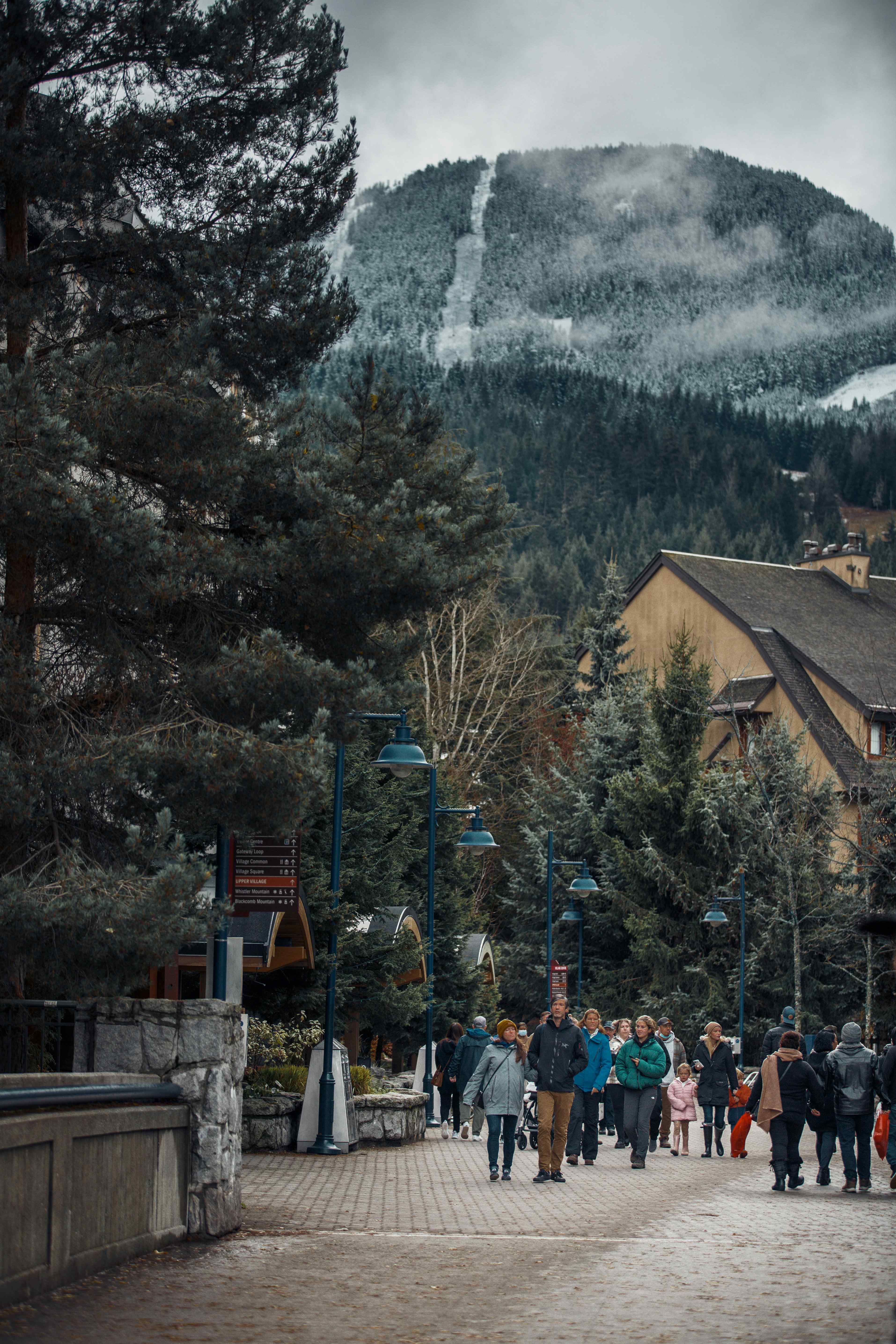 skiers walking through whistler village