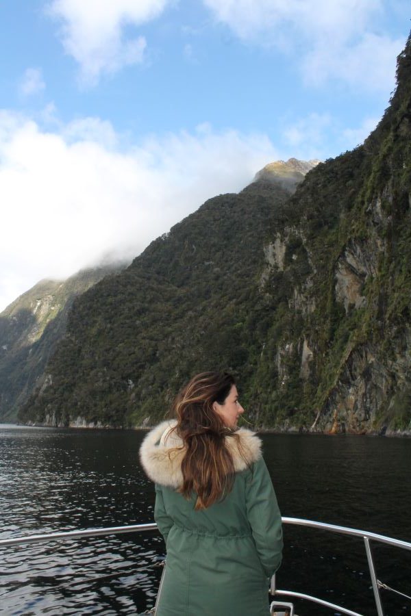 lady poses on a doubtful sound cruise