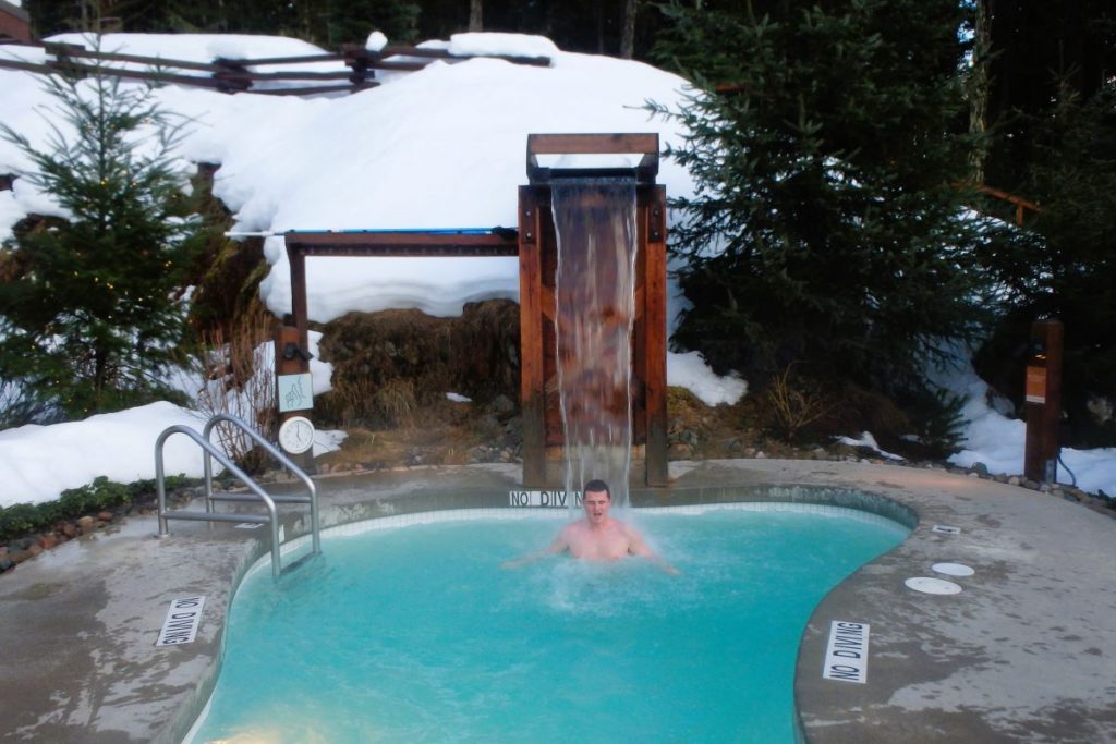 man in cold plunge pool scandinave spa whistler