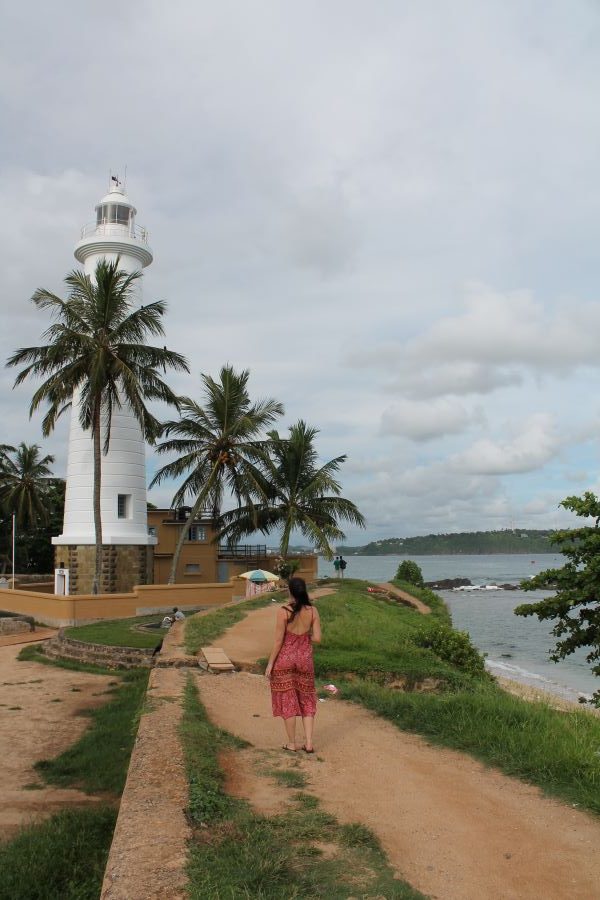 lady posing at galle lighthouse