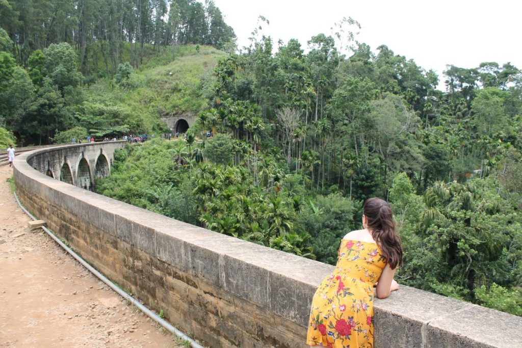 lady posing at start of nine arches bridge