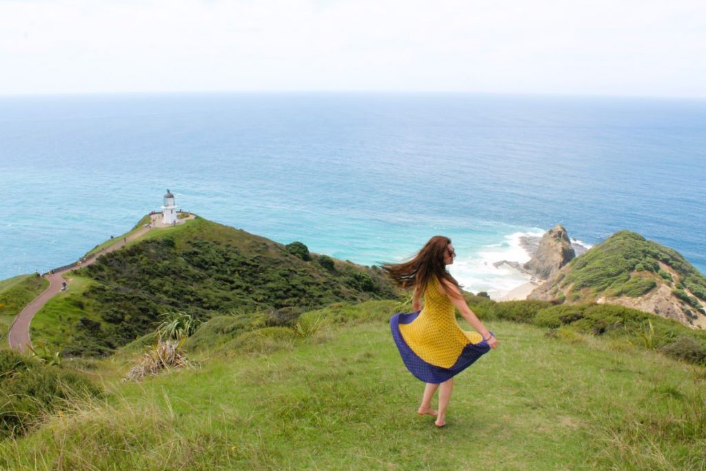 lady posing at cape reinga