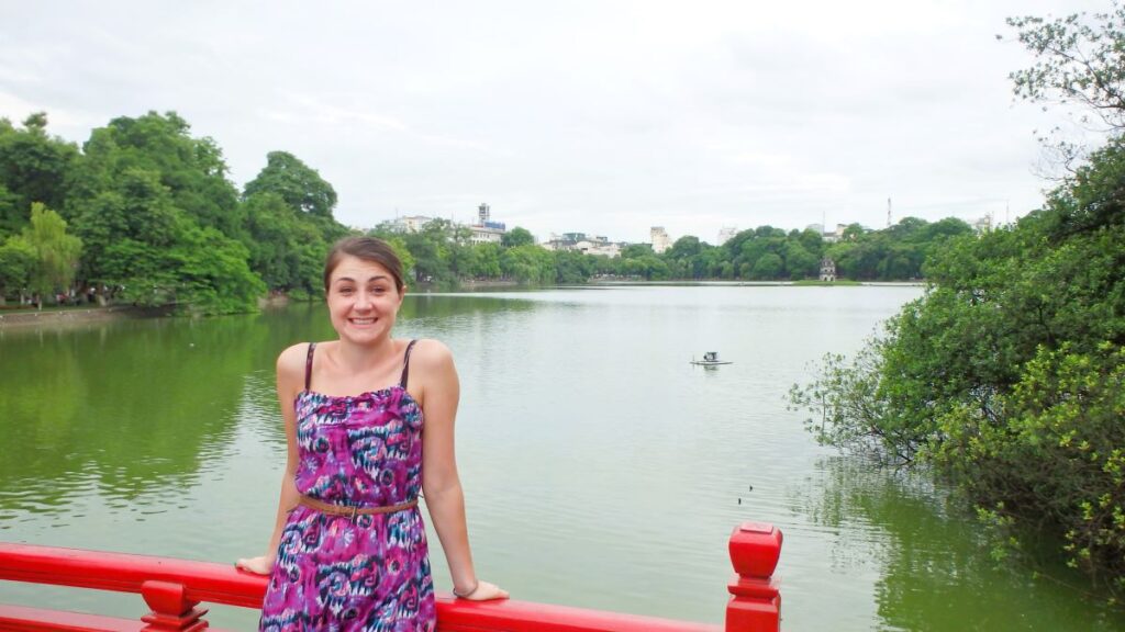 lady at red bridge hoan kiem lake