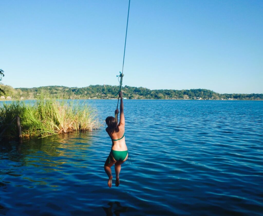 lady on rope swing lake peten itza