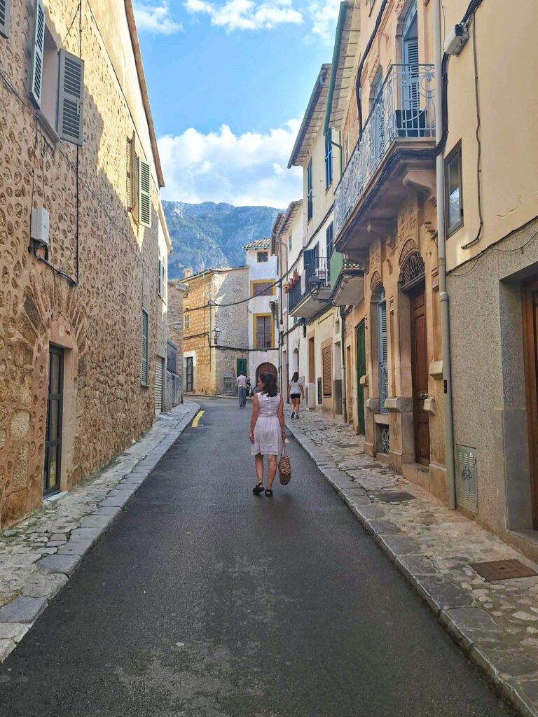 lady walking street in soller mallorca