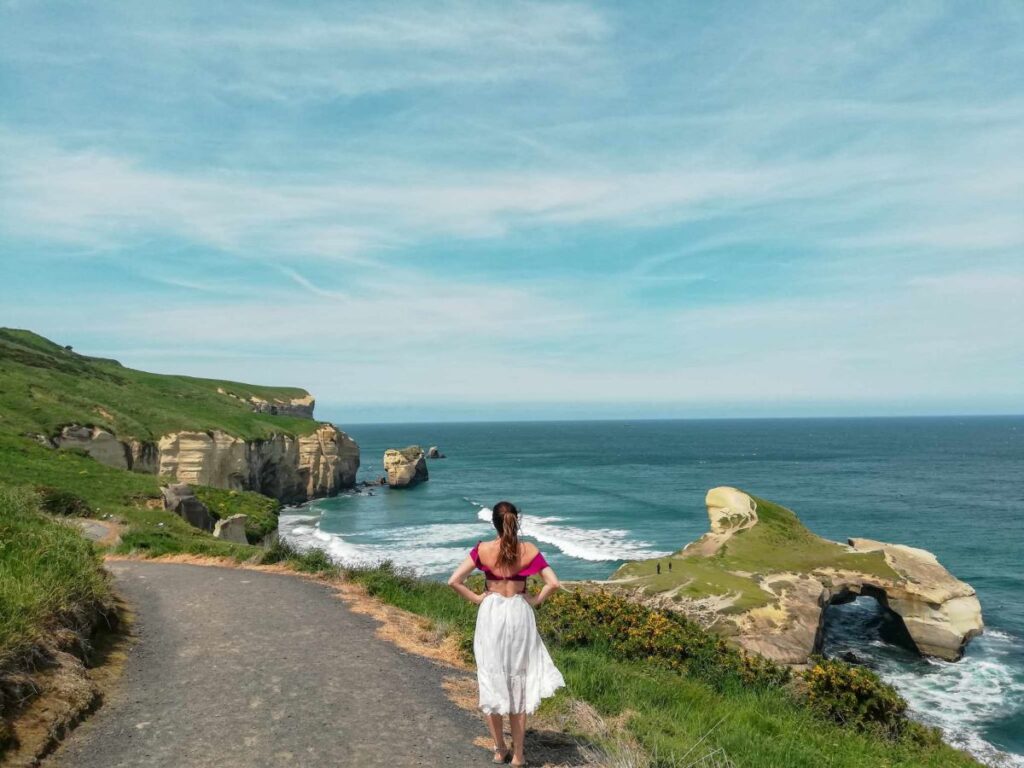 lady at sandfly bay new zealand