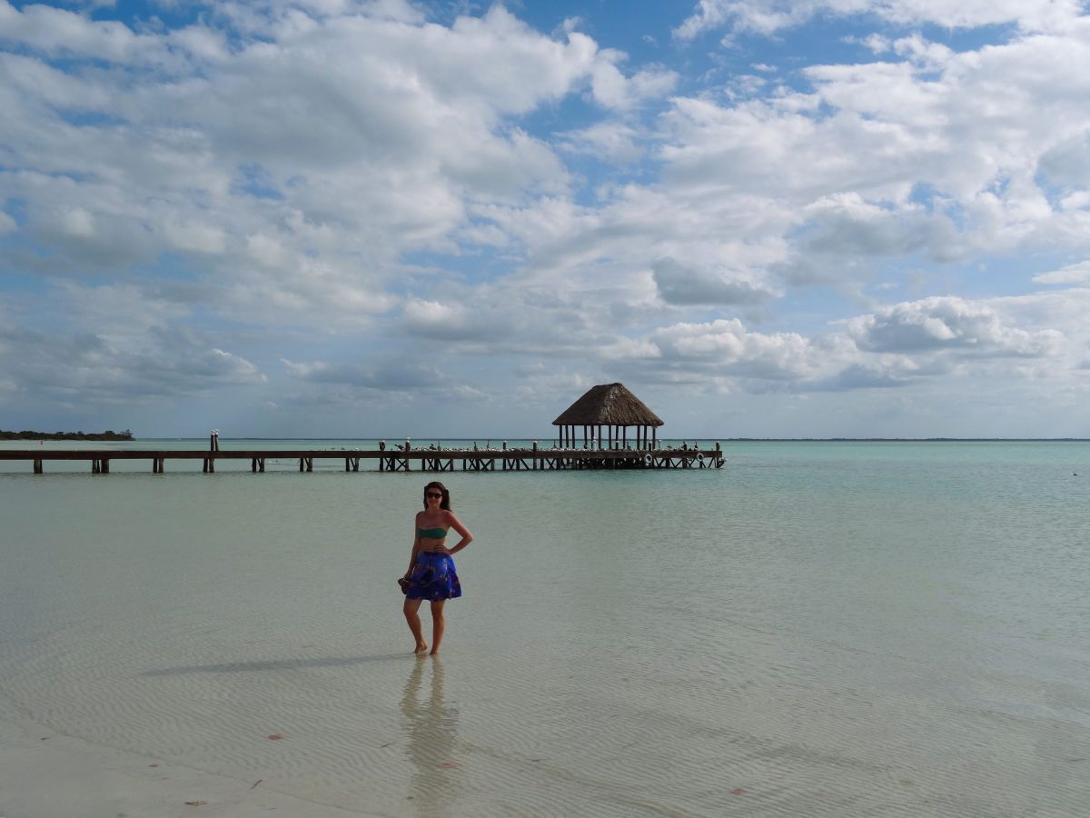 lady in water near pier holbox