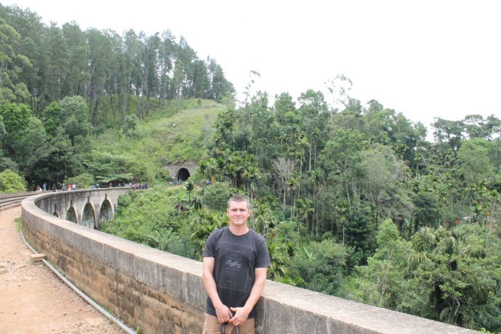 man at nine arches bridge ella