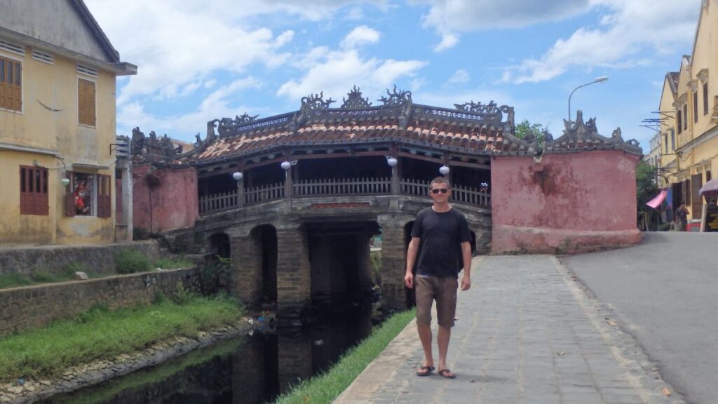 man at japanese bridge hoi an