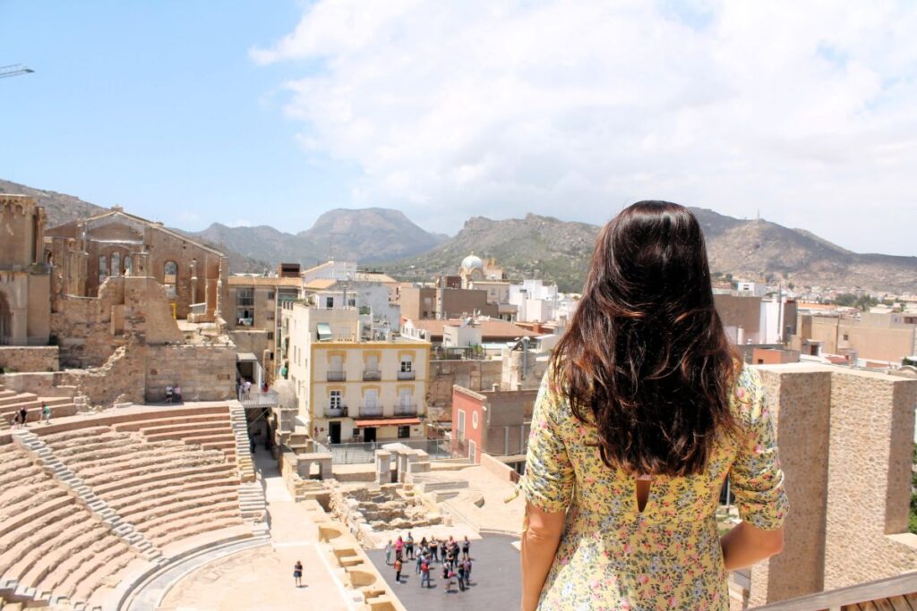 lady overlooking cartagena spain from roman ruins