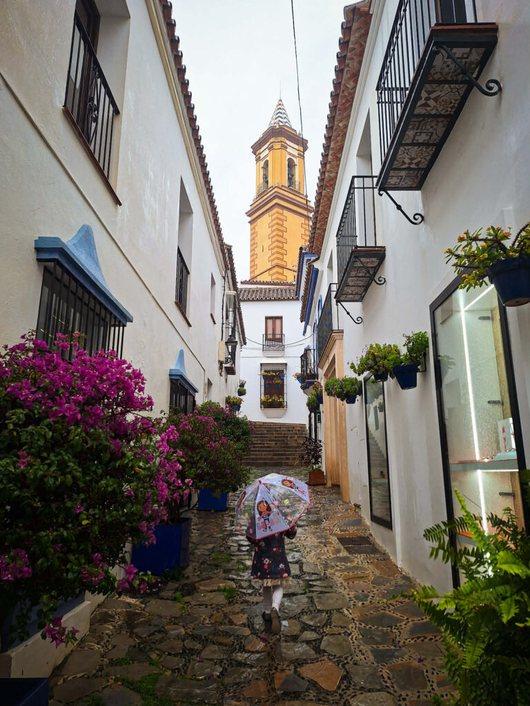 estepona street rainy day umbrella