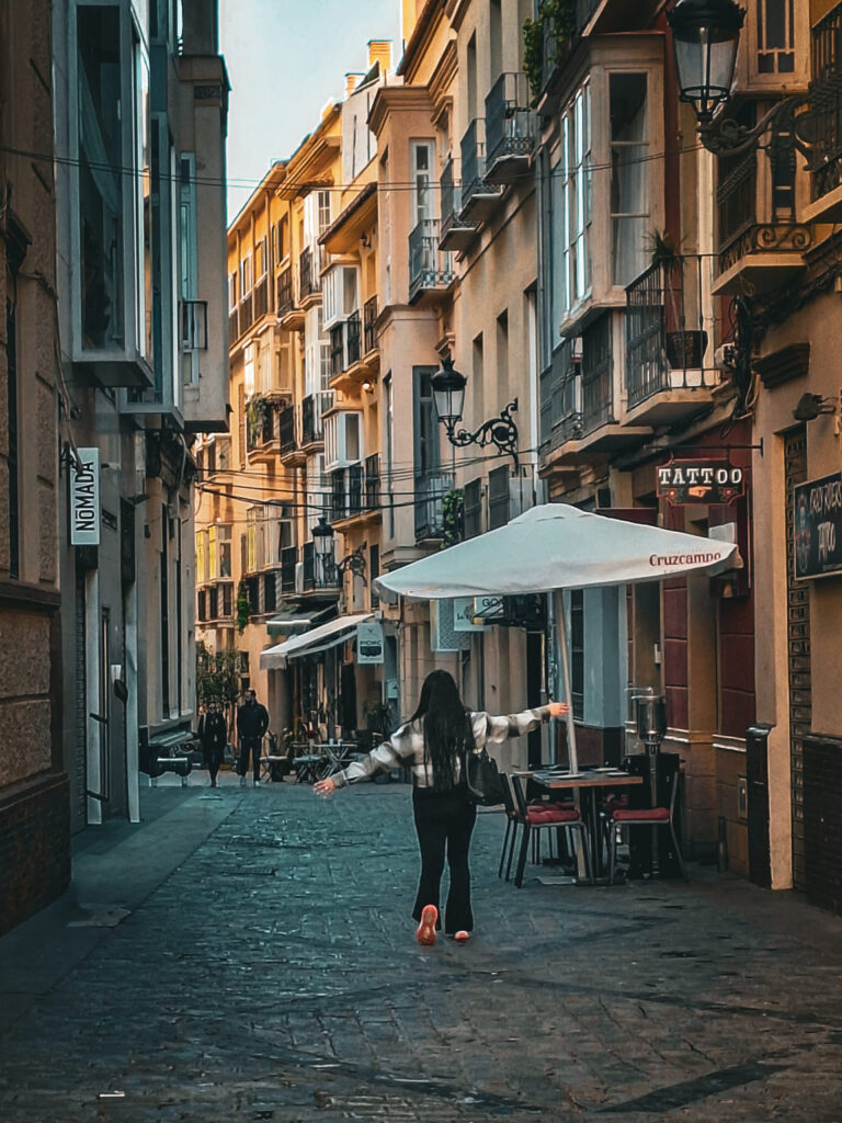 lady walking street malaga old town
