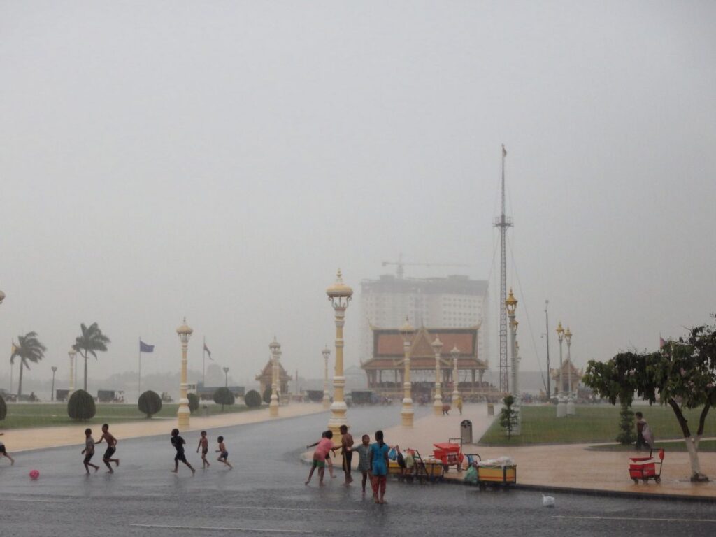 children playing in rain phnom penh