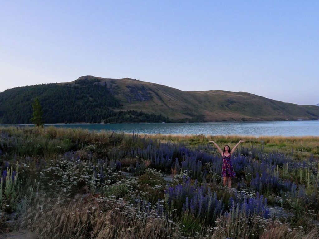 lady posing lake tekapo