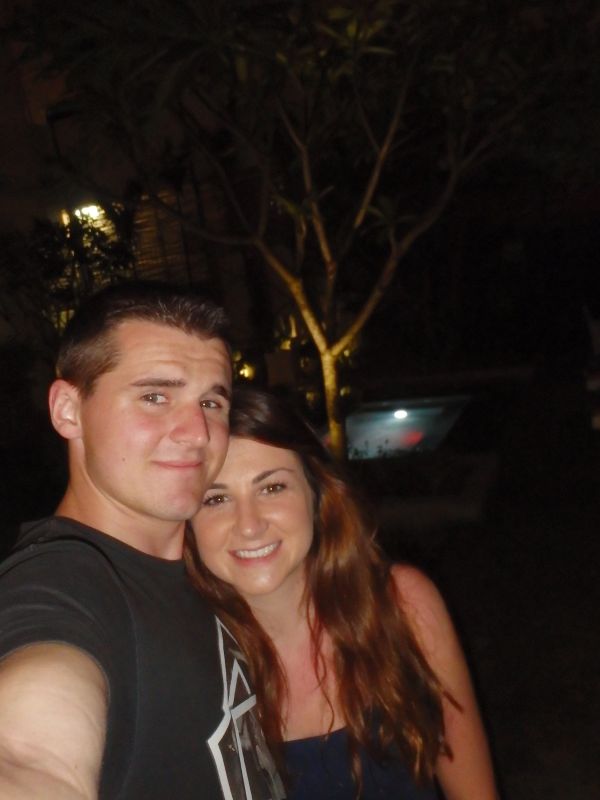 couple posing swimming pool
