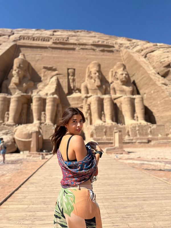 lady posing outside karnak temple